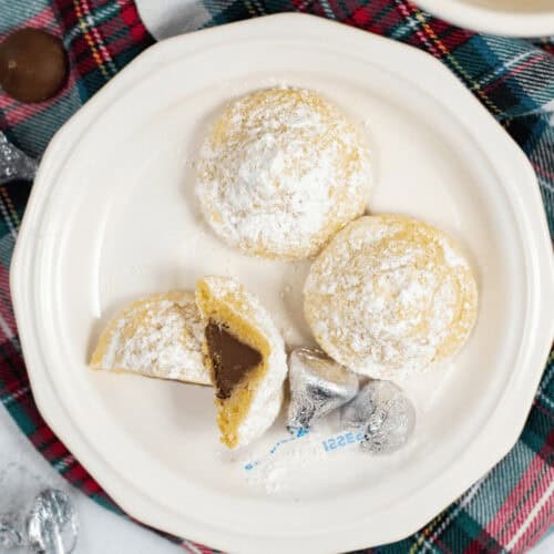 A cut open hershey kiss sugar cookie.