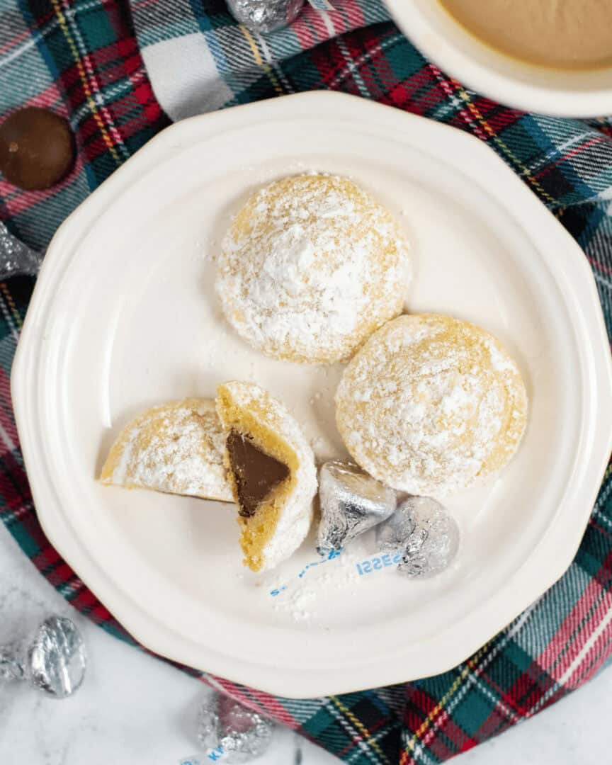 A cut open hershey kiss sugar cookie.