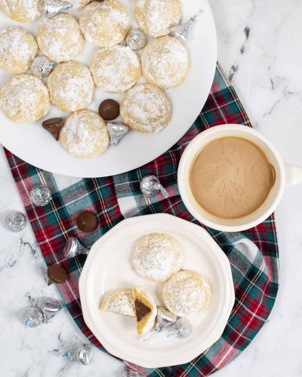 Coffee and a tray of the heshey kiss sugar cookies.