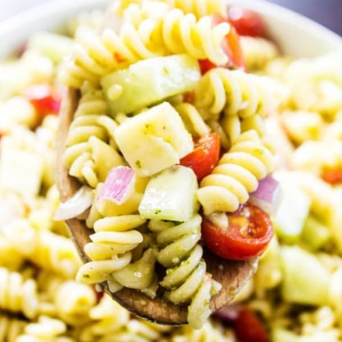 Pesto pasta salad with fresh vegetables
