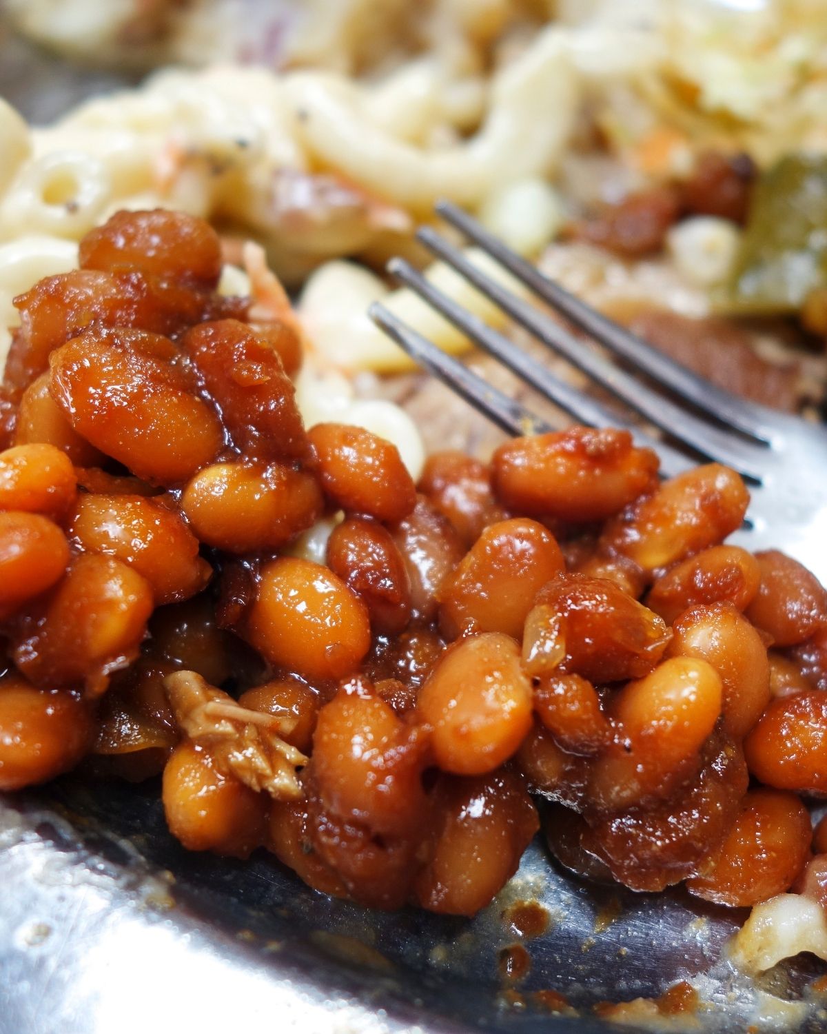 A fork in a side of beans.