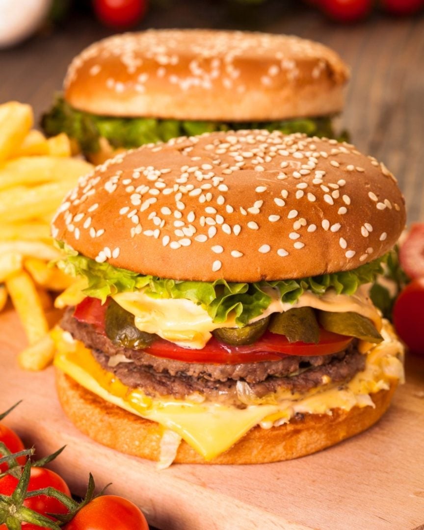 Finished oven burgers with lettuce and tomatoes.