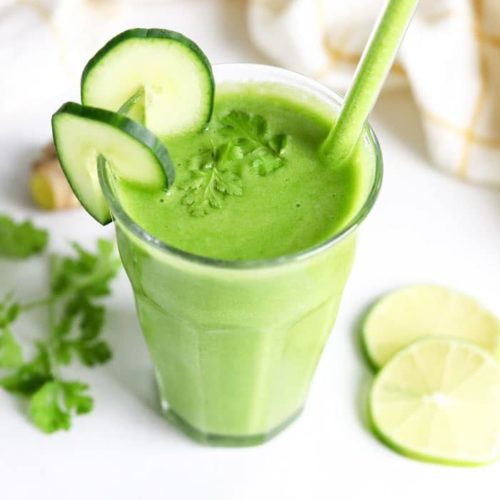 A Easy Detox Smoothie garnished with lime and mint leaves