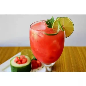 A Watermelon Cucumber Juice garnished with a lime