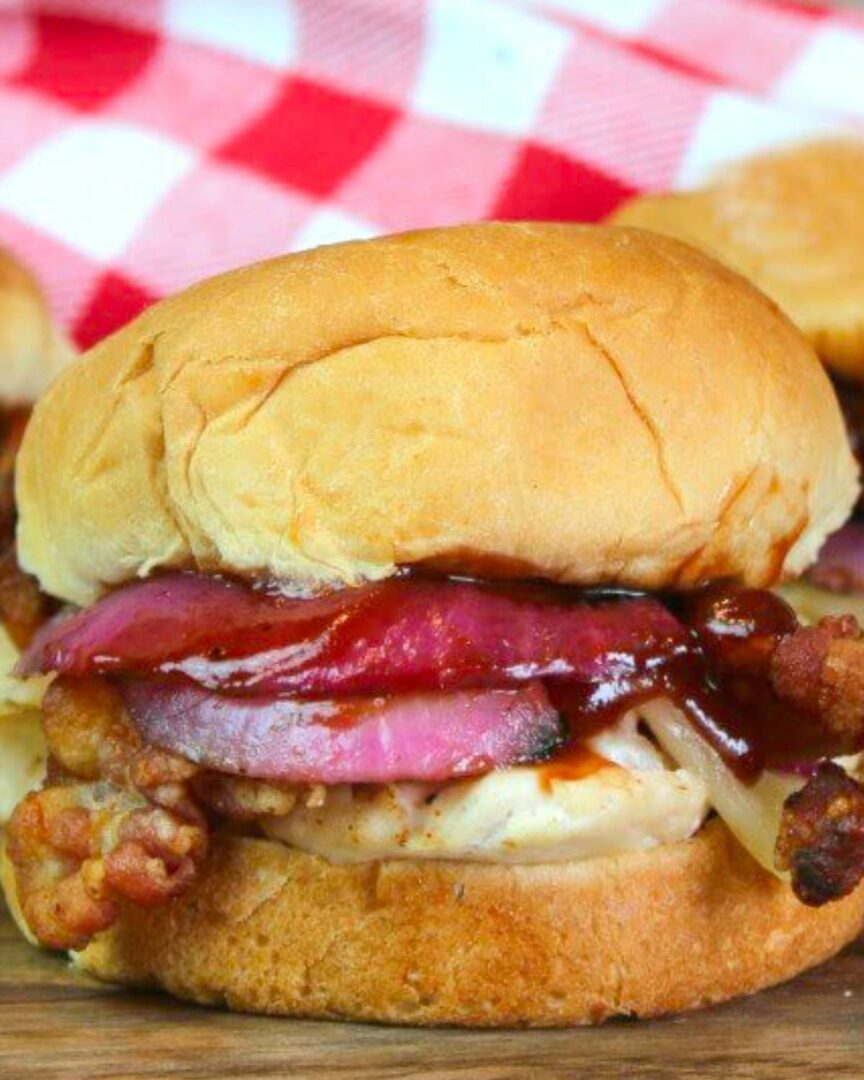 BBQ Chicken Sliders with a red and white checked napkin.