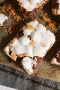 Baked Smores Bars on a cutting board.
