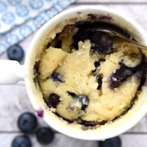 A blueberry muffin in a mug cake