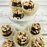 The caramel chocolate pretzels in paper cups.