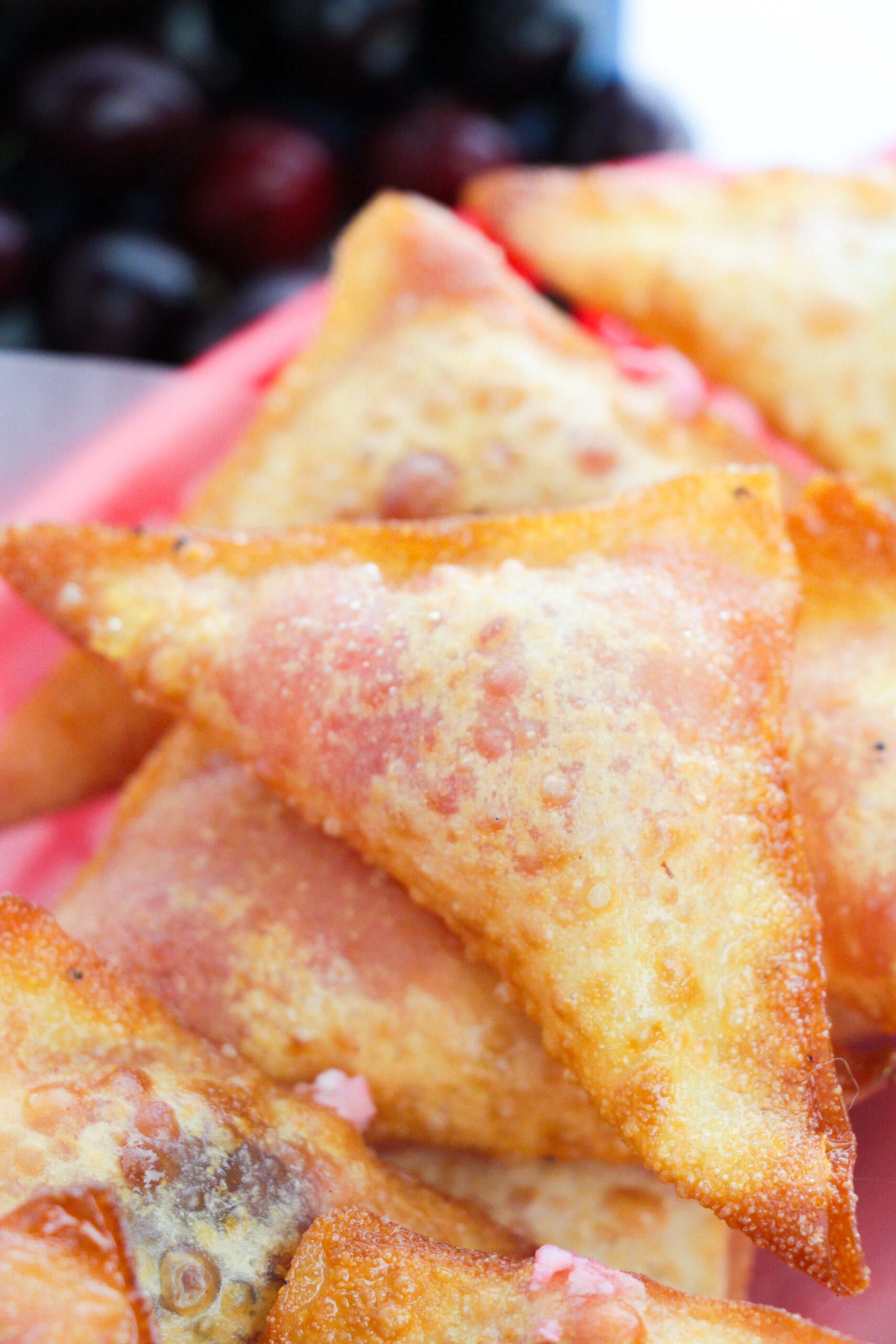 Little squares of cherry cheesecake wontons.