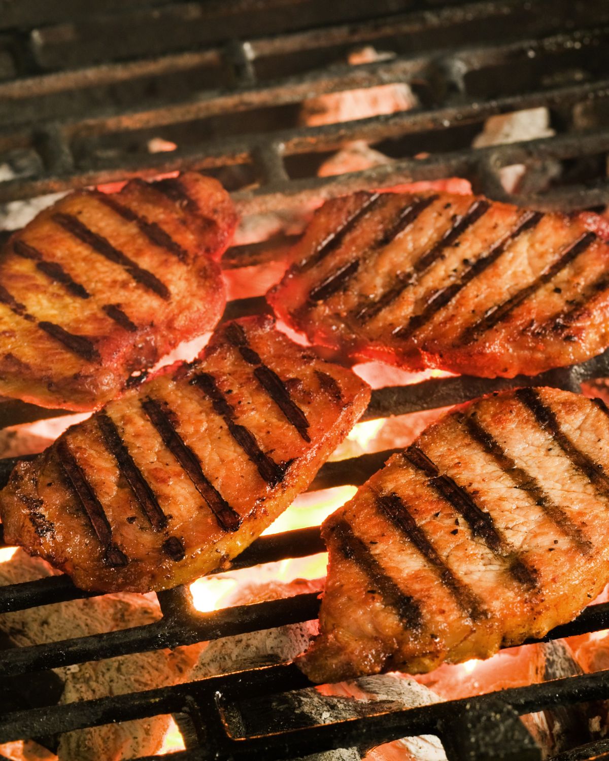 Grilled Pork Chops Marinade on a grill grate.