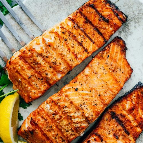 Several large filets of grilled salmon
