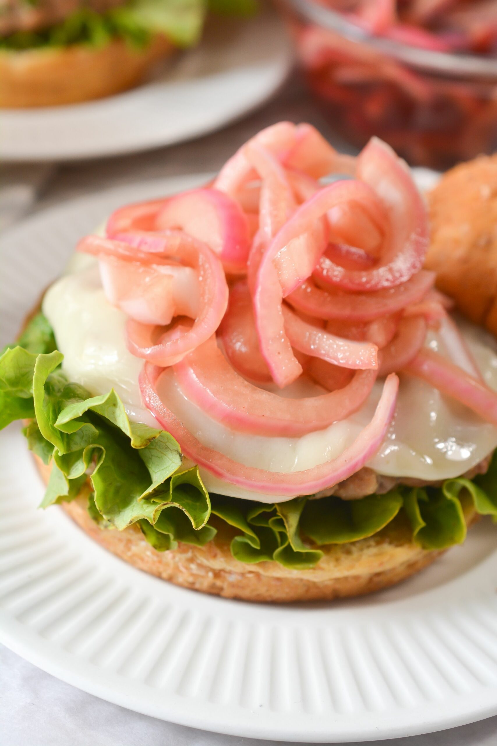 A view of the pickled onions on top of the burger.