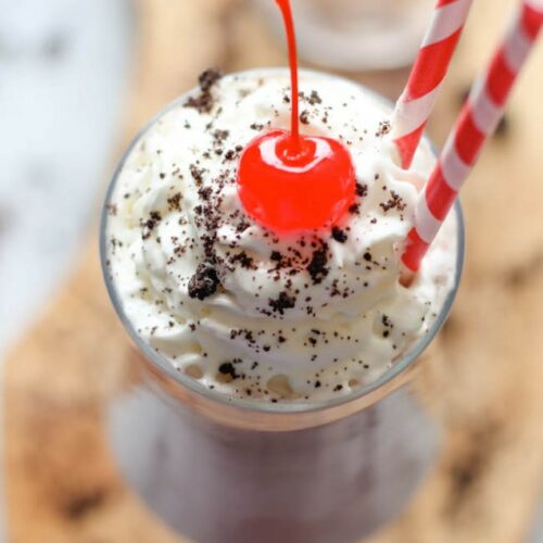 A Kahlua Cookies and Cream Milkshake garnished with a cherry