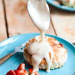 A drizzle of icing onto of the scone.