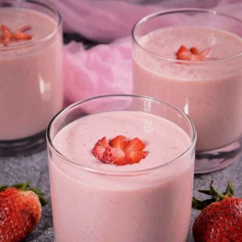 Three Strawberry Milkshakes Without Ice Cream garnished with strawberries