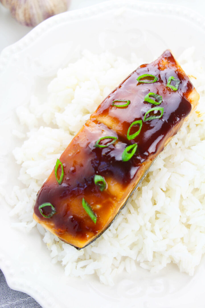 Teriyaki Glazed Salmon on a bed of white rice.
