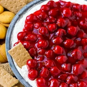 A bowl of cherry cheesecake dip