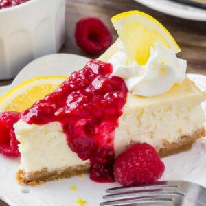 Lemon Cheesecake with raspberry sauce and lemon garnish