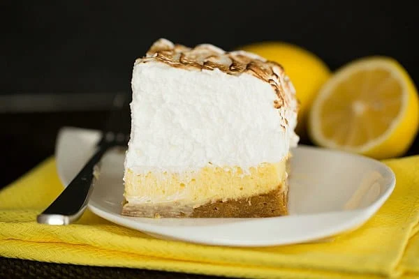 lemon meringue pie bars on a plate