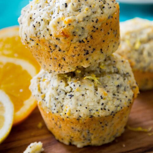 lemon orange poppyseed muffins stacked on top of one another
