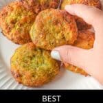 A hand picks up a zucchini fritter from a white plate with six golden-brown fritters; text reads "Best Air Fryer Zucchini Fritters – crispy, healthy, and easy to make.