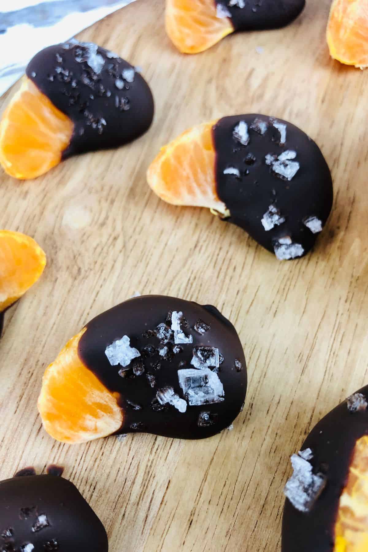 Dessert sprinkled with coarse sea salt, arranged on a wooden surface.