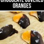 Orange segments partially dipped in dark chocolate and sprinkled with sea salt, arranged on a wooden surface. The image highlights delicious Chocolate Covered Oranges with a vibrant "Chocolate Covered Oranges" text banner.