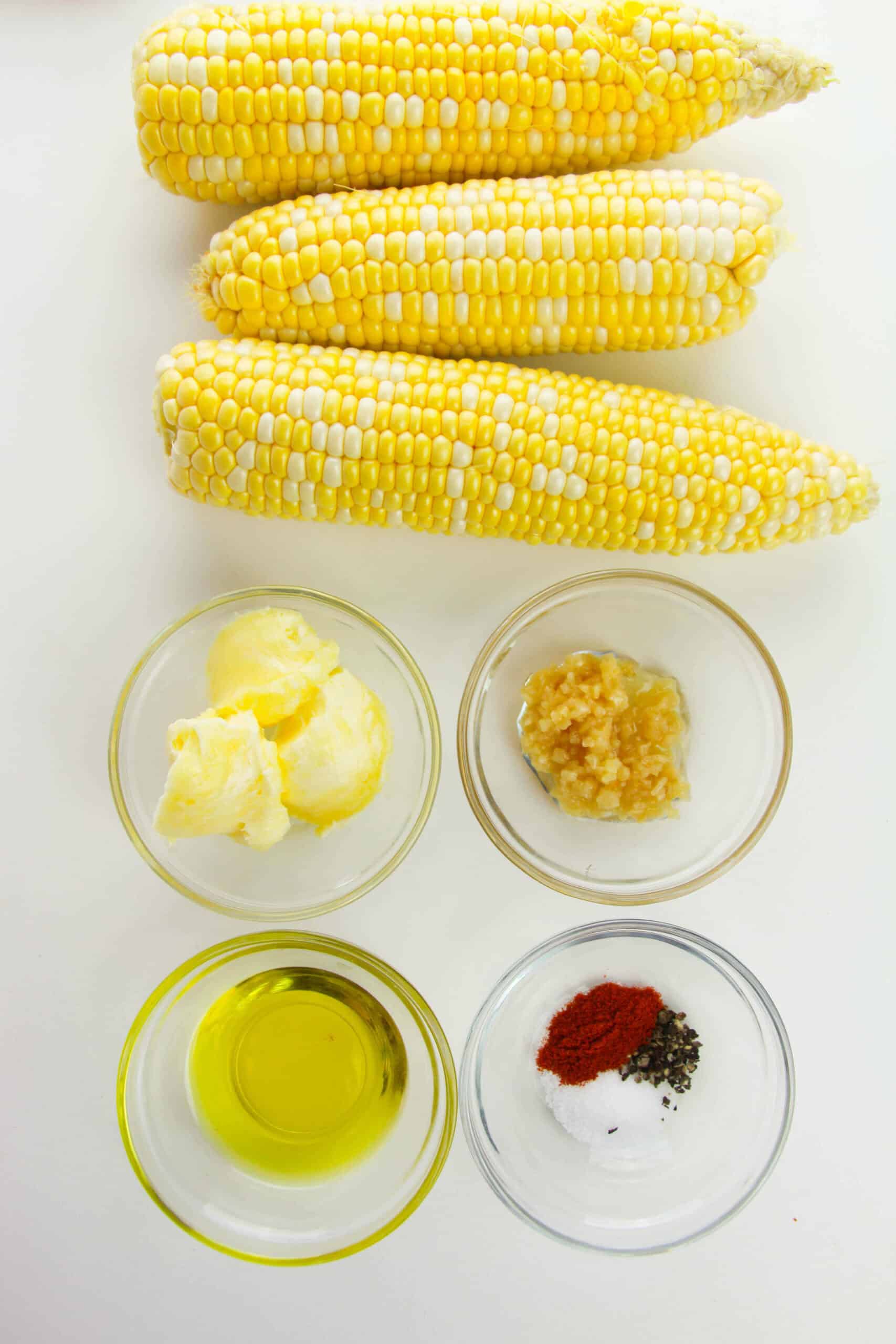 Corn on the cob recipe containing butter, minced garlic, olive oil, and a spice mixture of salt, pepper, and paprika—perfect for making Corn Ribs with Garlic Butter.