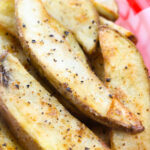 A basket of Crispy Spiced Potato Wedges.