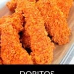 Doritos Crusted Chicken strips are arranged on a wooden board, their crunchy coating taking center stage. Text at the bottom reads, "Doritos Crusted Chicken.