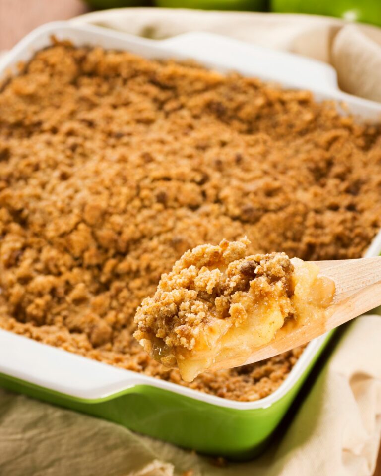 Easy Apple Crumble in a green casserole pan.