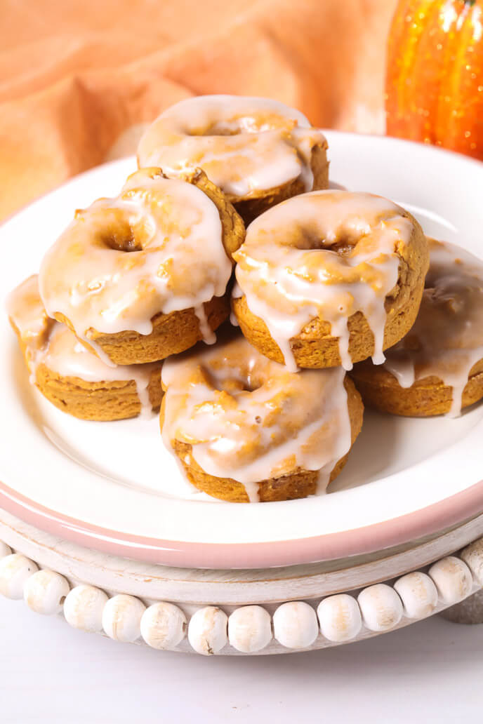 Pumpkin Cake Mix Donuts stacked up.