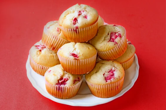 raspberry white chocolate chip muffins on plate