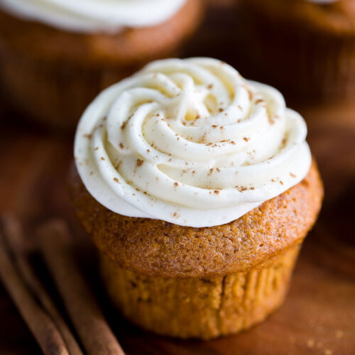 small batch pumpkin cupcakes with cream cheese frosting on top