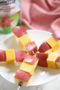 A design of fruit and cheese kababs.