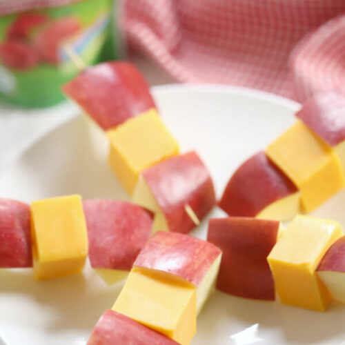 A design of fruit and cheese kababs.