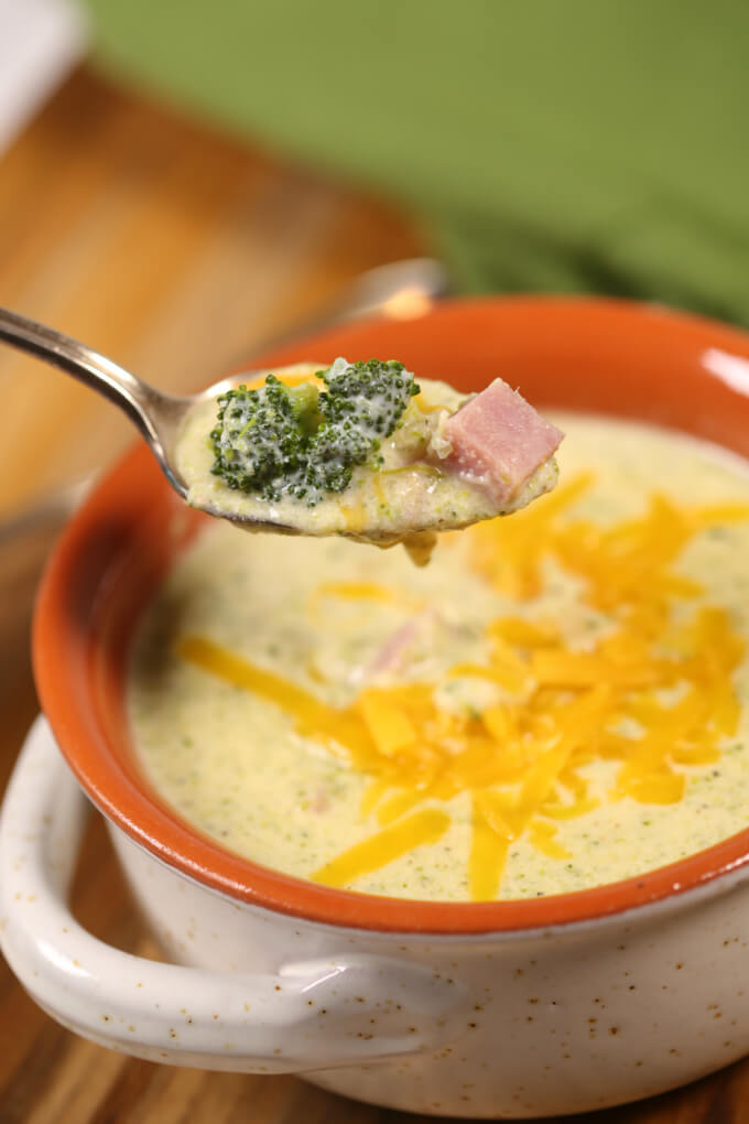 A spoon of Best Broccoli Cheese Soup.