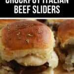 Close-up of mouthwatering Beef Sliders, featuring a Crockpot Italian beef slider with melted cheese and herbs on a wooden surface, accompanied by similar sliders in the background.