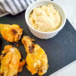 Garlic Parmesan Wings on a slate plate.