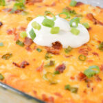 A casserole with sour cream on top.