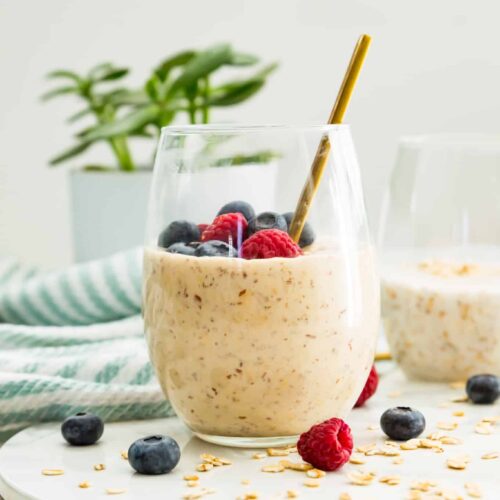 oats with berries on top in a jar