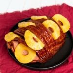 A whole spiral ham with pineapple.