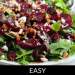 A vibrant beet salad with arugula, feta cheese, and pecans is beautifully pictured. The text "Easy Beet Salad with Feta" elegantly graces the bottom.