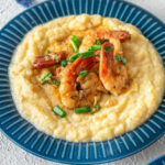 Cajun Shrimp and Grits in a blue bowl.