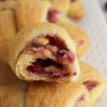 Cranberry Cheesecake Crescent Rolls open to reveal filling.
