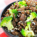 Korean Beef and Broccoli Noodles in a black bowl.