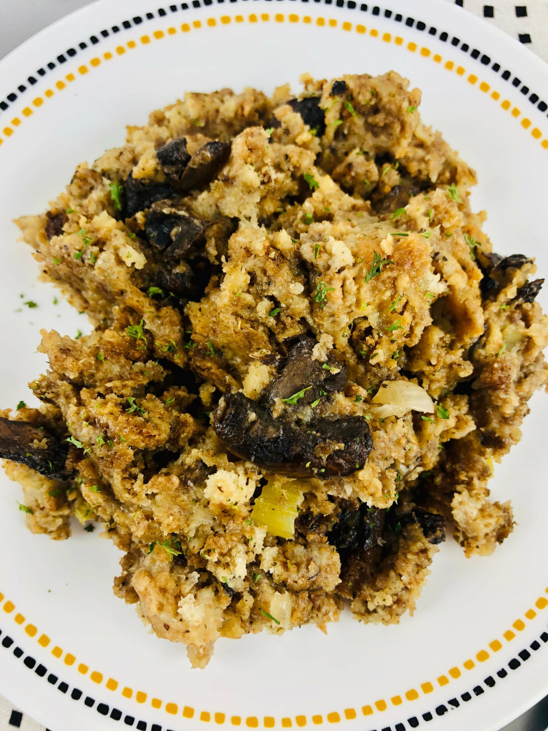 A bowl of the finished stuffing with mushrooms.