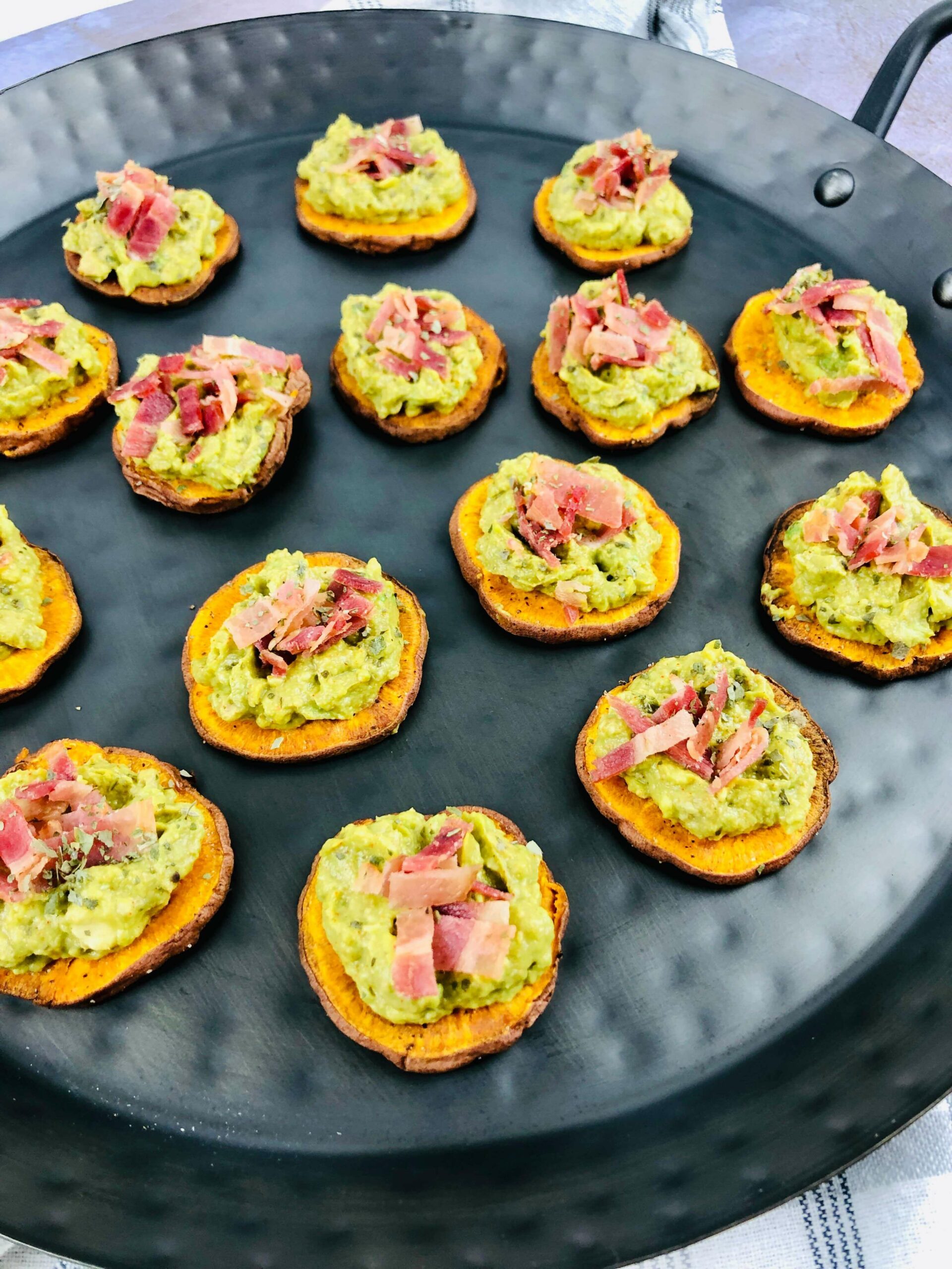 A tray of Sweet Potato Appetizer with Bacon and Avocado.