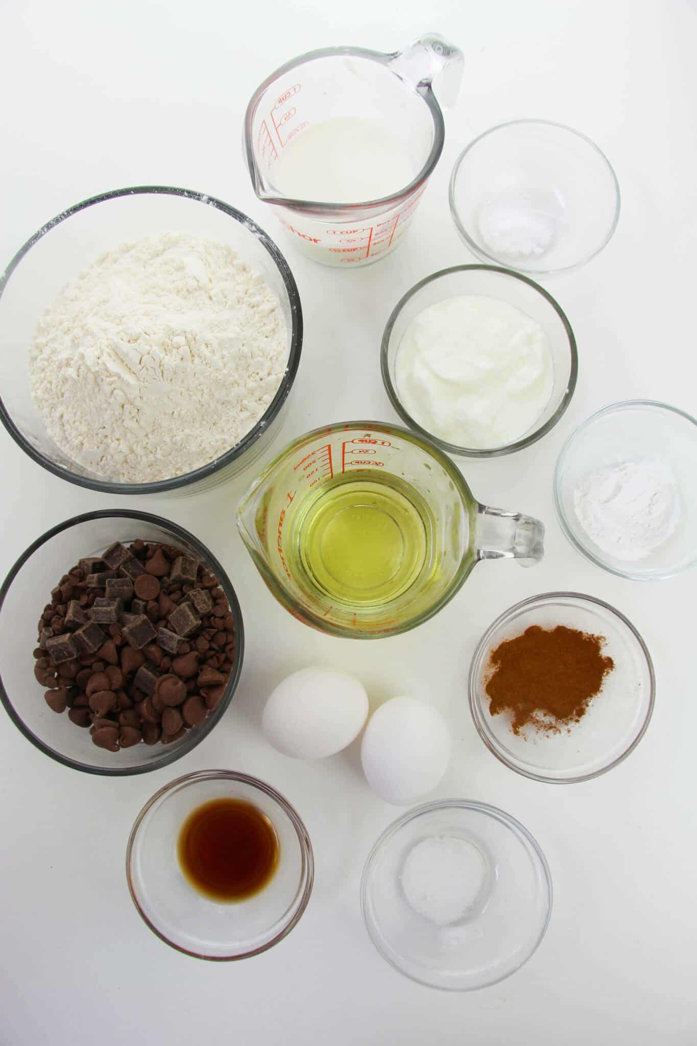 Flour, eggs, oil, chocolate chips to make the muffins.