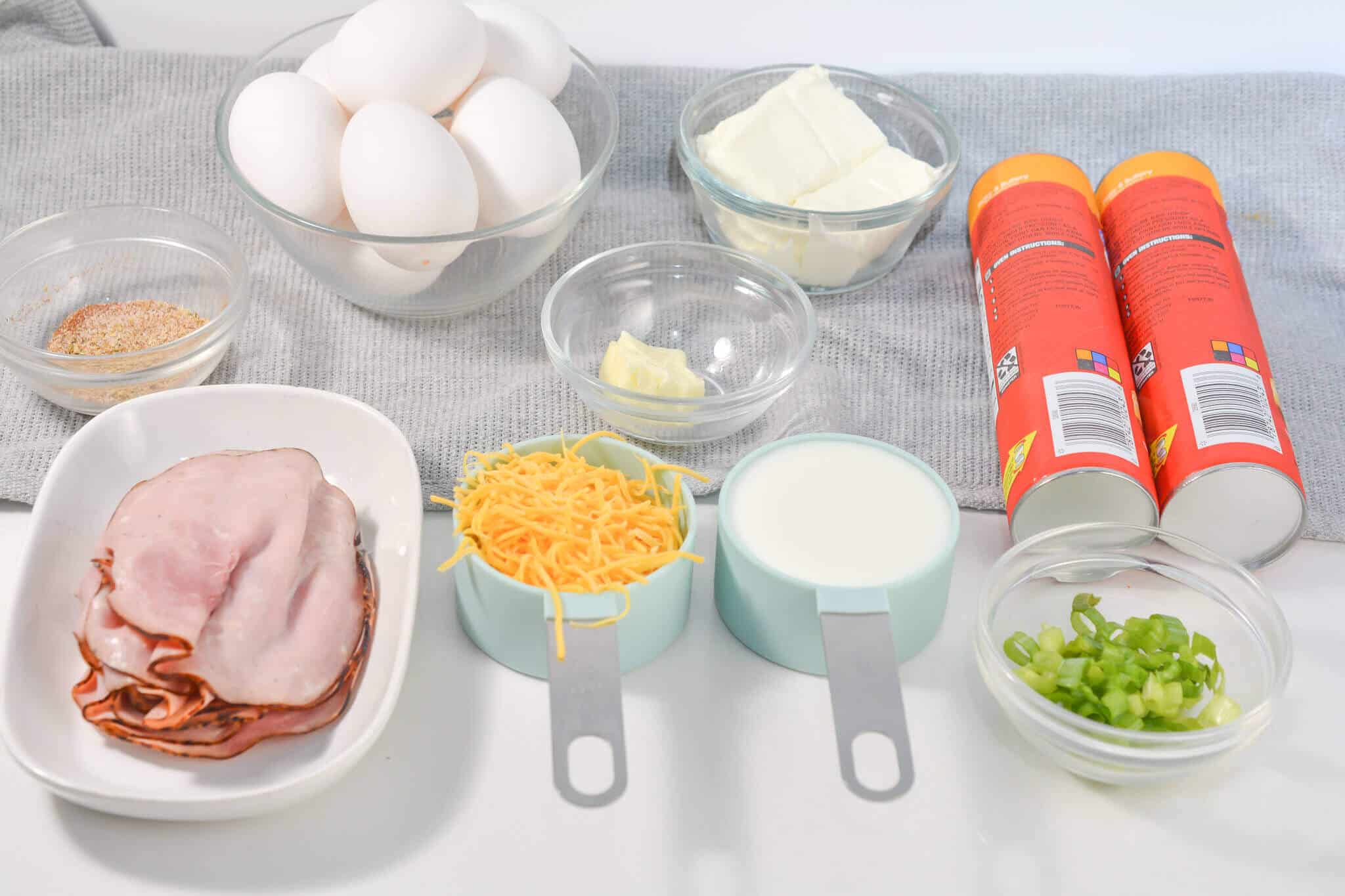 Ham, eggs, cheese, milk and veggies for the dish.
